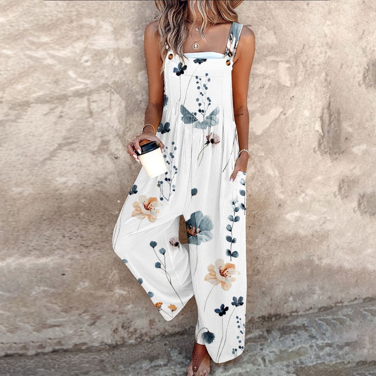 DIANA | SLEEVELESS FLORAL JUMPSUIT WITH GRACEFUL DRAPE