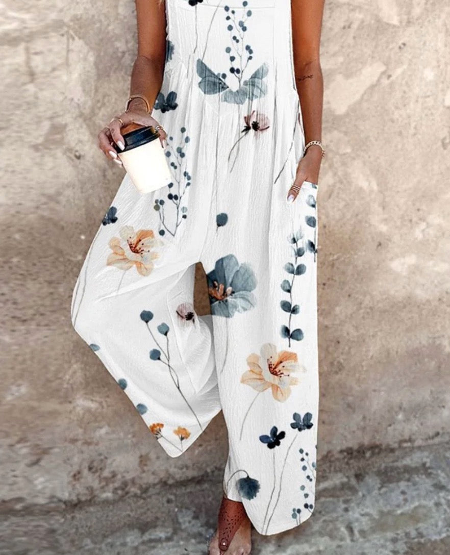 DIANA | SLEEVELESS FLORAL JUMPSUIT WITH GRACEFUL DRAPE